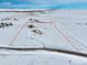 Aerial view showcasing the property's size and location in a snowy landscape at 7295 Sunset Ave, Elizabeth, CO 80107