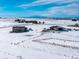 Aerial view of property showing house, barn, and distant mountains at 7295 Sunset Ave, Elizabeth, CO 80107