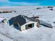 Aerial view of a large barn with horses, showing its size and functionality at 7295 Sunset Ave, Elizabeth, CO 80107