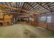 Spacious barn with multiple horse stalls and tack area at 7295 Sunset Ave, Elizabeth, CO 80107