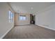 Finished basement room with stone fireplace and large windows at 7295 Sunset Ave, Elizabeth, CO 80107