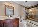 Basement bathroom with walk-in shower and wood-look tile at 7295 Sunset Ave, Elizabeth, CO 80107