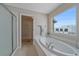 Bathroom includes a large garden tub, walk-in shower, and linen closet at 7295 Sunset Ave, Elizabeth, CO 80107