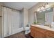 Basement bathroom with shower/tub combo and wood vanity at 7295 Sunset Ave, Elizabeth, CO 80107