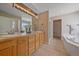 Bathroom features double vanity, large soaking tub, and walk-in shower at 7295 Sunset Ave, Elizabeth, CO 80107