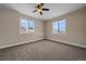 Basement bedroom with ceiling fan and two windows at 7295 Sunset Ave, Elizabeth, CO 80107