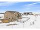 Two-story house with deck and hot tub, barn in background at 7295 Sunset Ave, Elizabeth, CO 80107