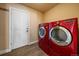 Bright laundry room features new LG washer and dryer, and an exterior door at 7295 Sunset Ave, Elizabeth, CO 80107