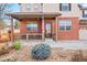 Inviting front porch with brick columns and landscaping at 6100 E 133Rd Ave, Thornton, CO 80602