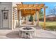 Patio with fire pit and pergola, perfect for outdoor living at 6100 E 133Rd Ave, Thornton, CO 80602