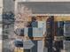 An aerial view showcasing the house, its roof, the fenced backyard and the surrounding neighborhood at 3606 S Olathe Way, Aurora, CO 80013