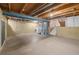 Unfinished basement area featuring laundry appliances and stairs to the upper level at 3606 S Olathe Way, Aurora, CO 80013