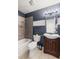 Bathroom featuring a bathtub, tiled shower, toilet, and vanity at 3606 S Olathe Way, Aurora, CO 80013