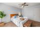 Comfortable bedroom featuring a ceiling fan, stylish headboard, and plush bedding at 3606 S Olathe Way, Aurora, CO 80013