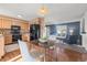 Eat in kitchen with dining area and view to the living room featuring modern appliances and ample cabinetry at 3606 S Olathe Way, Aurora, CO 80013