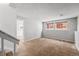 Inviting living room featuring two windows and neutral walls at 3606 S Olathe Way, Aurora, CO 80013