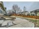 Spacious backyard featuring a concrete patio, lawn, and wooden fence, creating a private outdoor oasis at 17611 E 104Th Pl, Commerce City, CO 80022