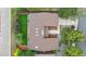 Aerial view showcases the home's roof, well-manicured lawn, landscaping, and driveway at 11254 E Colorado Dr, Aurora, CO 80012