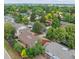 Aerial view of a residential neighborhood featuring mature trees and well-maintained lawns at 11254 E Colorado Dr, Aurora, CO 80012