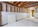 Unfinished basement ready to be customized to your needs with exposed beams and concrete floor at 11254 E Colorado Dr, Aurora, CO 80012