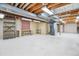 Unfinished basement offering storage with a concrete floor and exposed ceiling at 11254 E Colorado Dr, Aurora, CO 80012