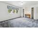 Spacious bedroom features neutral carpet, a large window with custom valance, and built-in vanity at 11254 E Colorado Dr, Aurora, CO 80012