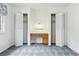 Bright bedroom with white walls and two closets surrounding a built-in desk at 11254 E Colorado Dr, Aurora, CO 80012