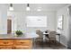 Contemporary dining area with sleek furnishings, hardwood floors, and natural lighting at 11254 E Colorado Dr, Aurora, CO 80012