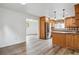 Spacious kitchen featuring updated appliances and wood cabinetry at 11254 E Colorado Dr, Aurora, CO 80012