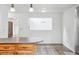 Bright eat-in kitchen with gray countertops, stainless steel appliances, and wood-look floors at 11254 E Colorado Dr, Aurora, CO 80012