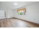A bright living room featuring natural light, wood floors, and a decorative window at 11254 E Colorado Dr, Aurora, CO 80012