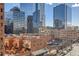 View of the brick buildings and glass high rises from a high rise apartment balcony at 1551 Larimer St # 704, Denver, CO 80202