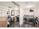 Functional laundry room with modern washer and dryer units, ample storage shelves, and mirrored closet doors at 1551 Larimer St # 704, Denver, CO 80202