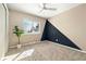 Bedroom with neutral walls, a ceiling fan, a window with a view, and tan carpet at 12843 W Jewell Cir, Lakewood, CO 80228