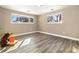 Spare bedroom featuring a window, wood flooring and minimal decorations at 12843 W Jewell Cir, Lakewood, CO 80228