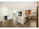 Open kitchen layout featuring an island with additional oven and stainless steel appliances at 12843 W Jewell Cir, Lakewood, CO 80228