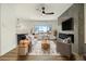 Stylish living room featuring modern decor, a cozy fireplace, and ample natural light at 12843 W Jewell Cir, Lakewood, CO 80228