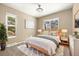 Spacious bedroom features a large bed, carpet, bright windows, and neutral colors at 12843 W Jewell Cir, Lakewood, CO 80228