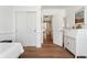 Bedroom featuring hardwood floors, a writing desk, and a view of a hallway at 10618 Clearview Ln, Highlands Ranch, CO 80126