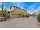 Two-story home with neutral siding and a two-car garage and a spacious driveway for additional parking at 10618 Clearview Ln, Highlands Ranch, CO 80126