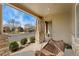 Relax on the covered front porch swing, a cozy spot to enjoy the neighborhood views at 10618 Clearview Ln, Highlands Ranch, CO 80126