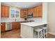 Stylish kitchen featuring wood cabinets, white countertops, and stainless steel appliances at 10618 Clearview Ln, Highlands Ranch, CO 80126