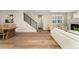 Bright and airy living space featuring hardwood floors, a fireplace, and staircase at 10618 Clearview Ln, Highlands Ranch, CO 80126