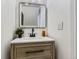 Bright bathroom featuring a modern vanity with a light wood finish, white countertop, and black hardware at 12172 E Kepner Pl, Aurora, CO 80012