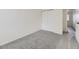 Bright bedroom features neutral carpet, a closet, and an open doorway at 12172 E Kepner Pl, Aurora, CO 80012