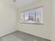 Clean bedroom with a large window providing natural light and neutral-colored carpeting at 12172 E Kepner Pl, Aurora, CO 80012