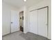 Bedroom with neutral carpet and large closet perfect for storage at 12172 E Kepner Pl, Aurora, CO 80012