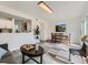 Bright dining area with table set, sliding glass doors, and a view to the laundry at 12172 E Kepner Pl, Aurora, CO 80012