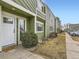 Well-maintained exterior with green siding, white trim, and a welcoming front door at 12172 E Kepner Pl, Aurora, CO 80012