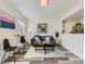 Comfortable living room with modern decor, gray sofa, and stylish coffee table at 12172 E Kepner Pl, Aurora, CO 80012